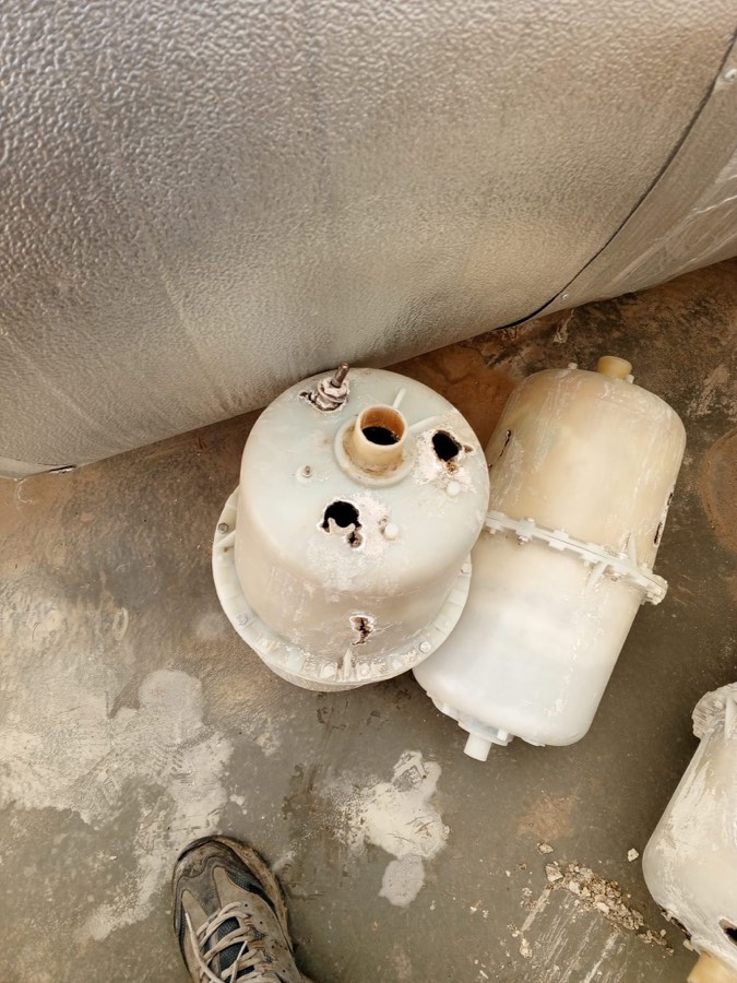 Electrode cylinder wear - plastic cylinder pierced by scale buildup