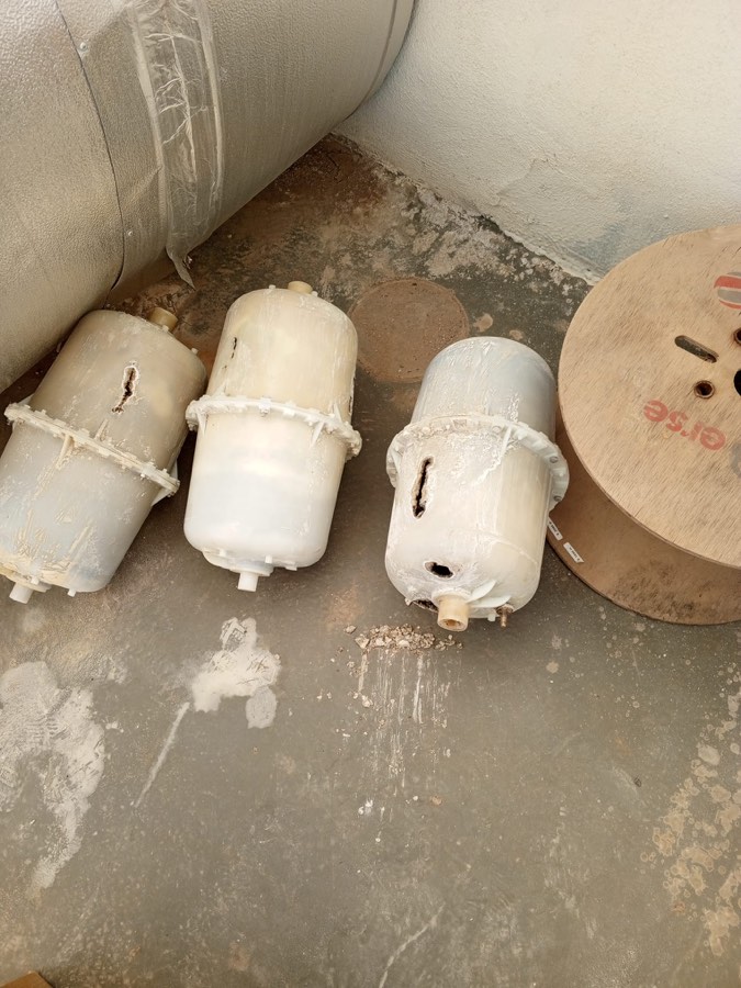 Used electrode cylinders - plastic waste awaiting disposal