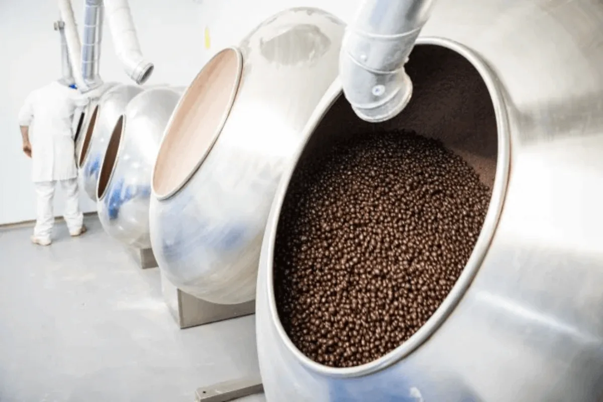 Inside a chocolate dragee coating pan